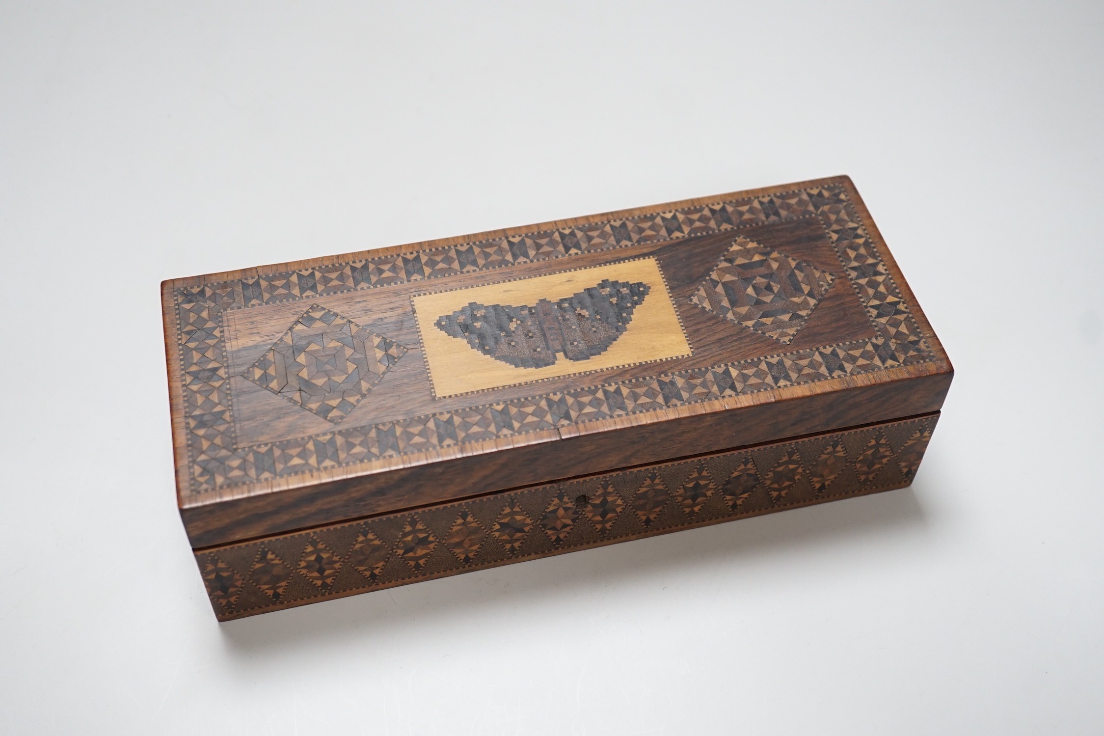 A Tunbridge ware rosewood half square mosaic and butterfly mosaic glove box, c.1830-50, 24cms wide x 6.5 high